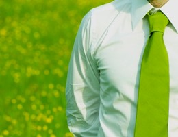 business manager outdoor with green necktie