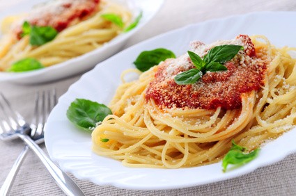 Pasta with tomato sauce basil and grated parmesan