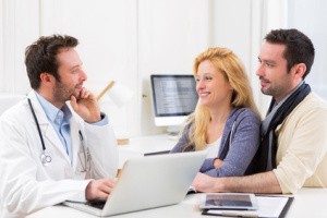 Young attractive couple seeing a doctor
