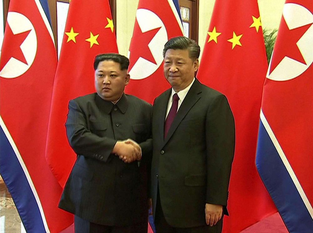 kim-Jon-un-e Xi Jinping